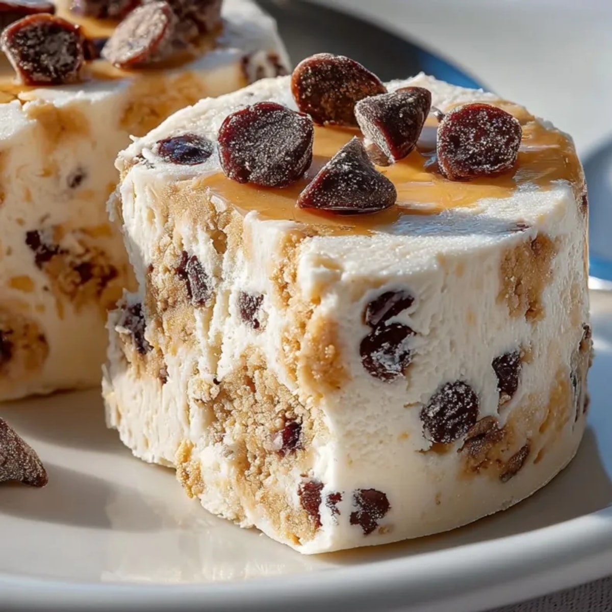 Frozen Greek Yogurt Peanut Butter Bites with Chocolate Chips arranged on parchment paper, creamy and chilled.