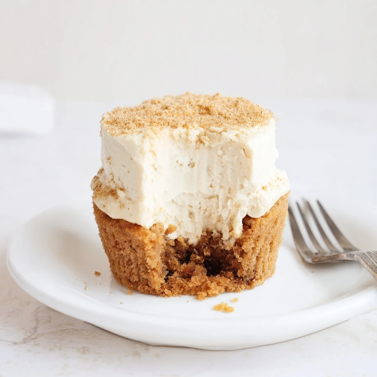Delicious Chai Latte Muffin Cheesecake Cups topped with cinnamon sugar for a sweet treat.  