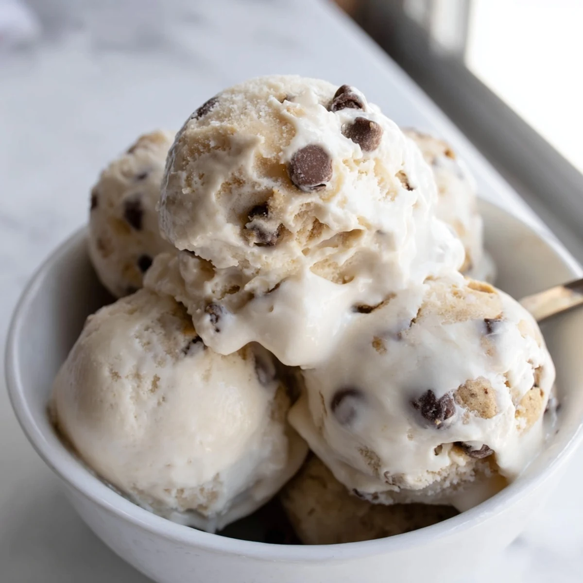 Creamy Cottage Cheese Ice Cream with Cookie Dough and chocolate chip bursts.  