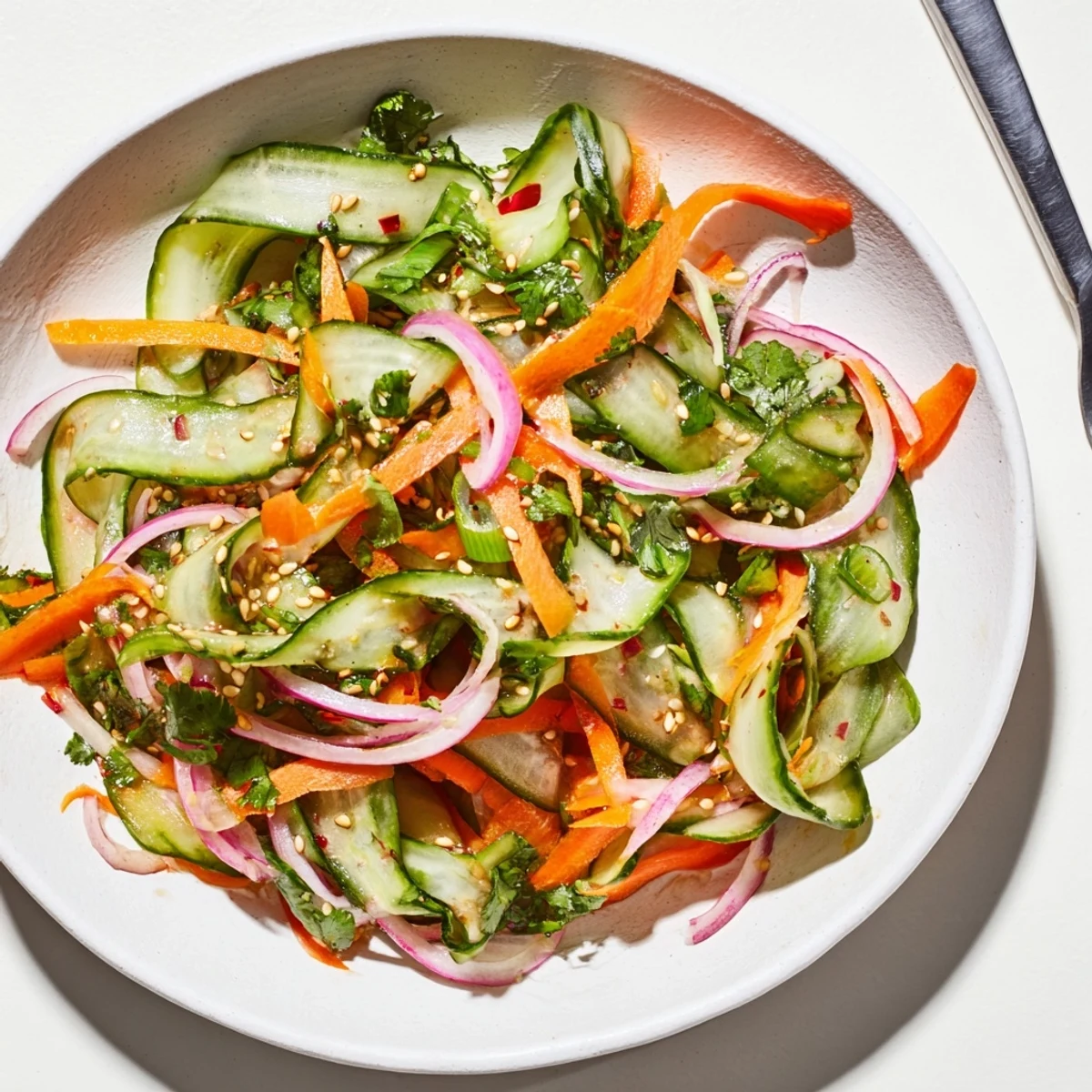 Colorful cucumber salad remix featuring tangy rice vinegar and a hint of ginger.