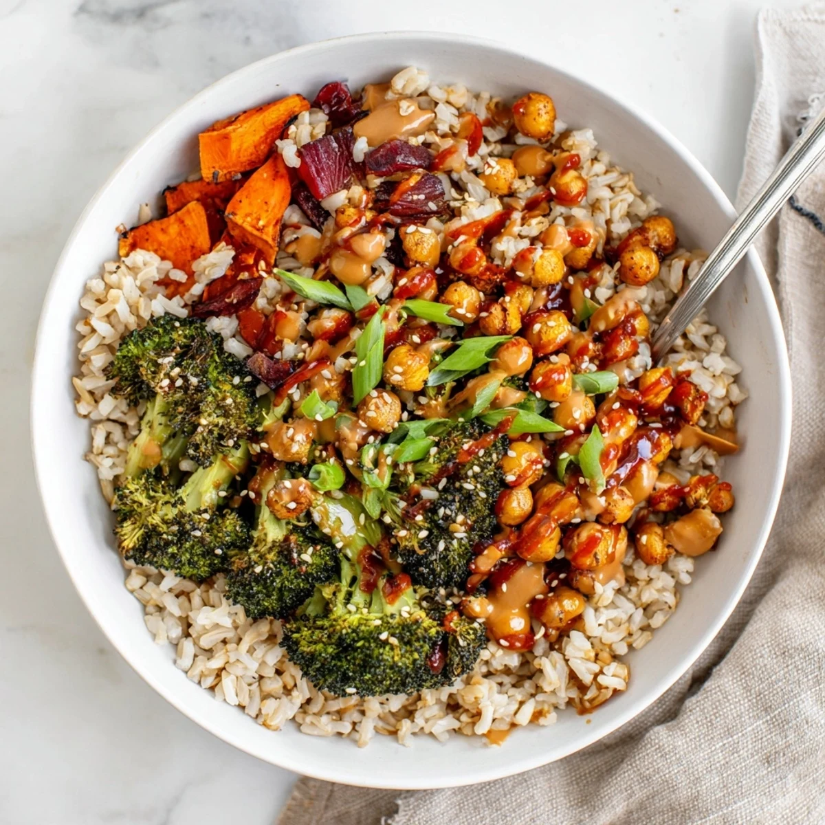 Vibrant Bold Sauce Drizzle Bowls topped with roasted veggies and two flavorful sauces.  