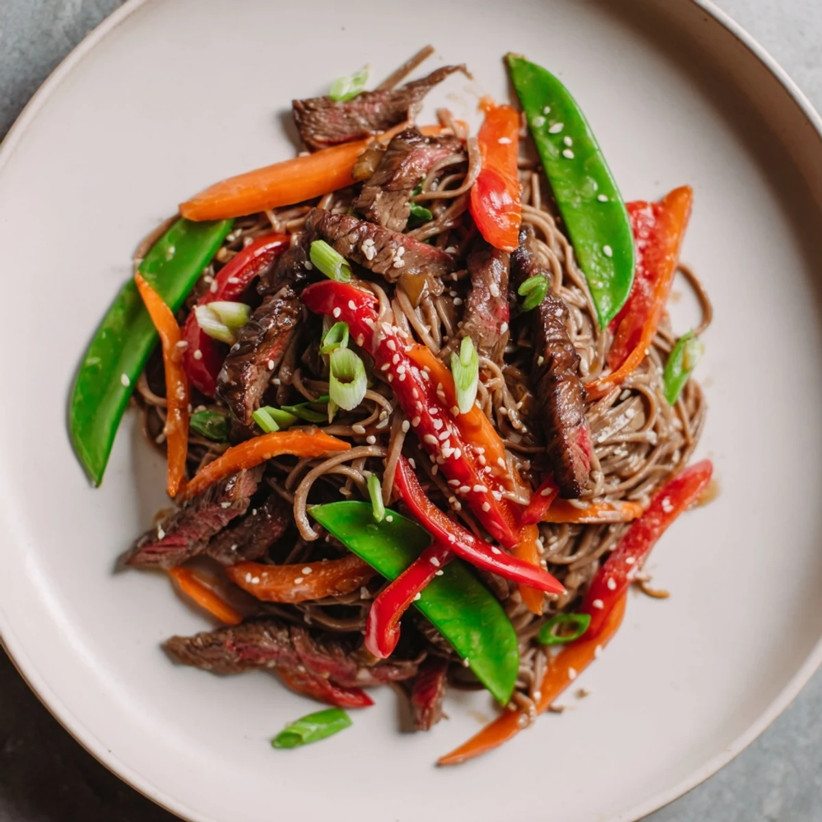 Savory Teriyaki Beef & Noodle Bowl features tender beef, colorful veggies, and coated noodles for dinner.