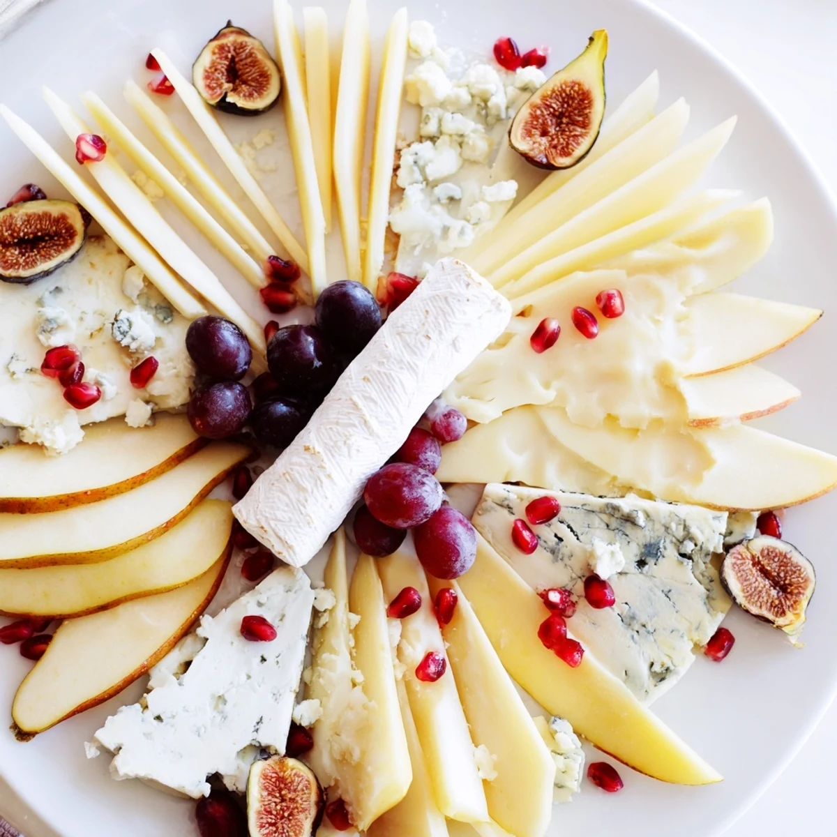 A beautiful Star of Bethlehem cheese platter with colorful fruit, honey, and a variety of cheeses, ready to serve.