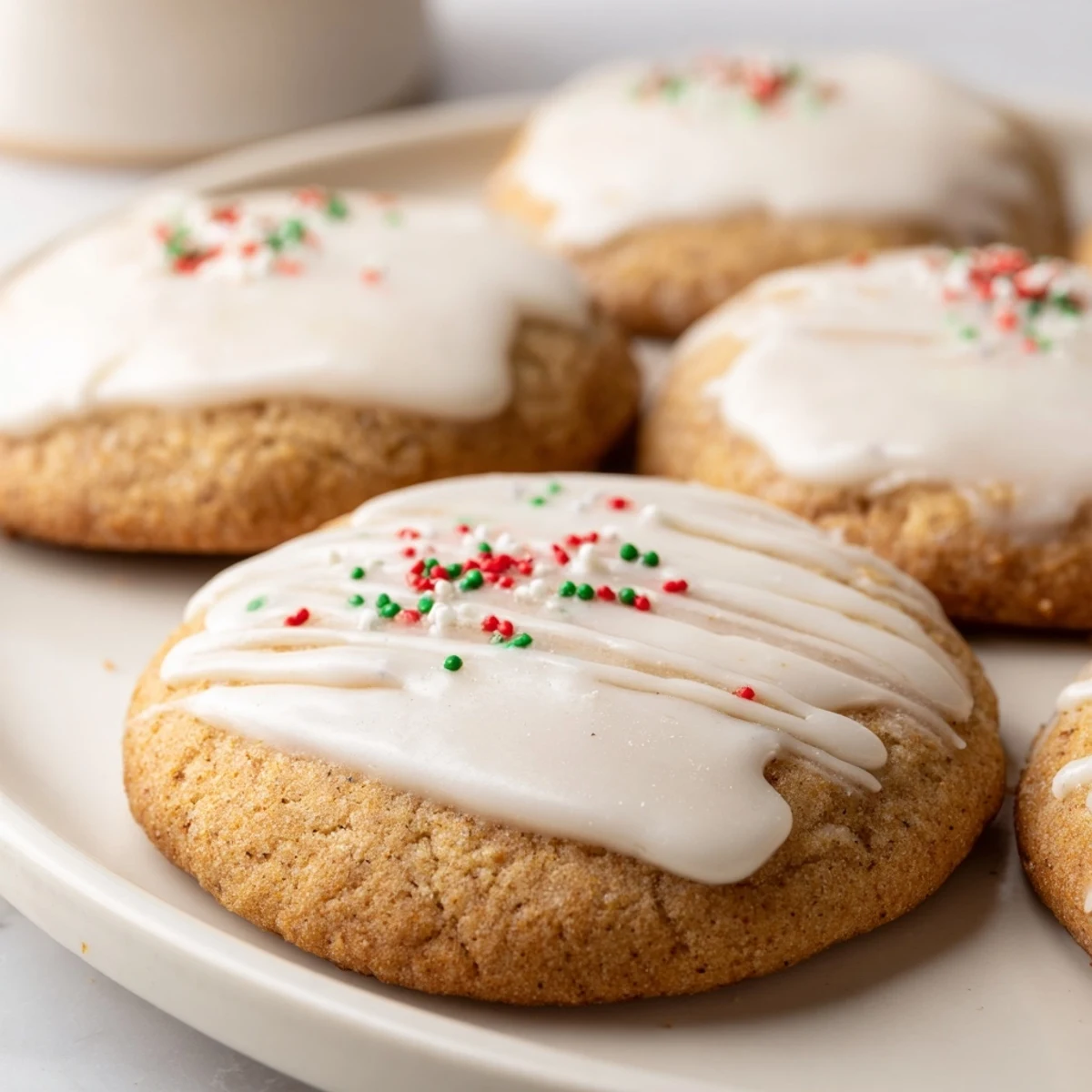 These homemade Holiday Cookies with Icing Drizzle showcase delicate, iced tops over buttery, round treats, ready to be enjoyed.