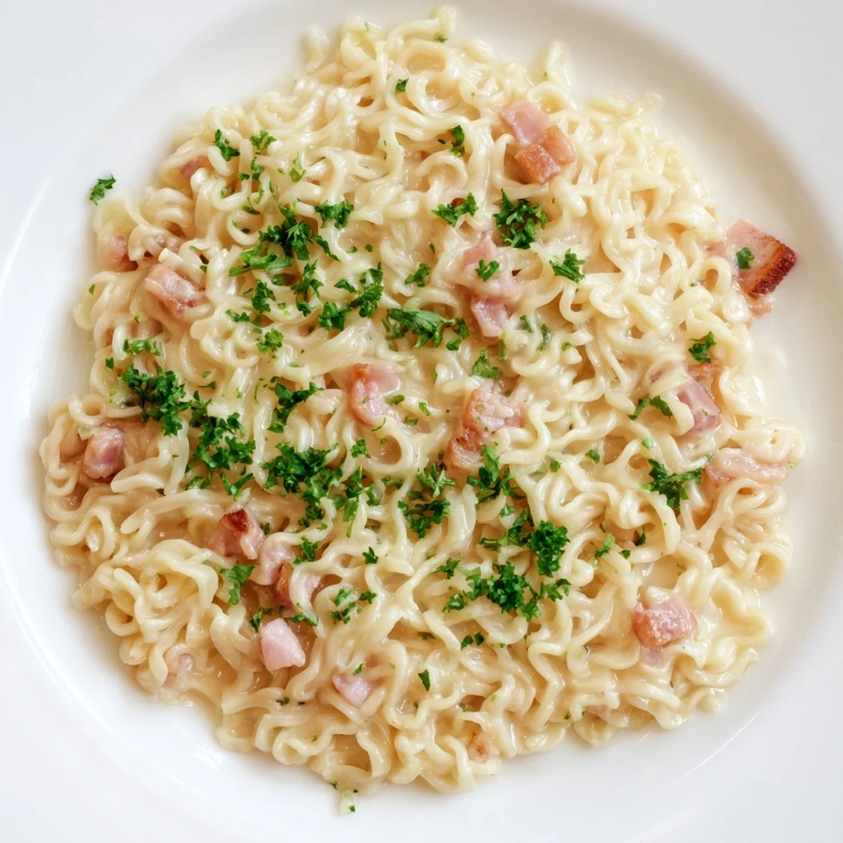 Ramen Carbonara Hack: a bowl of creamy ramen with cheese and optional bacon bits.