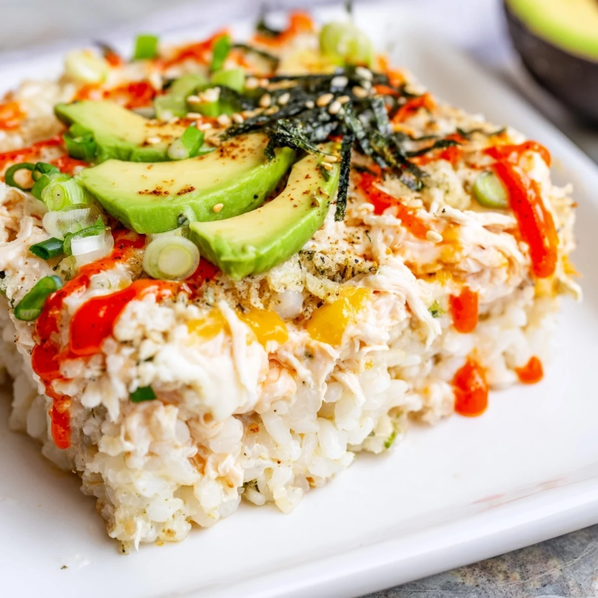 Golden brown Chicken Sushi Bake, a comforting casserole with melted cheese and delicious chicken.