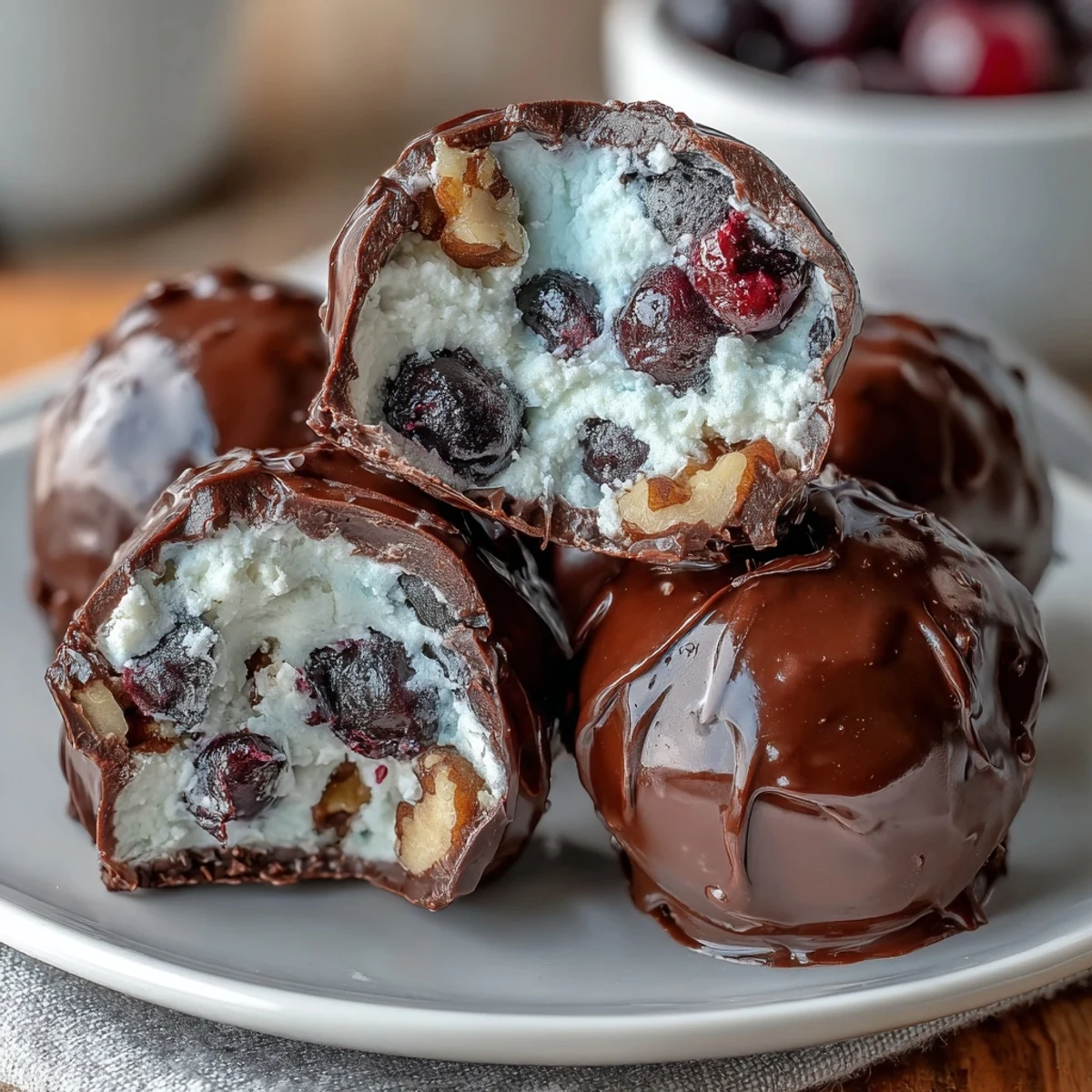 Wholesome frozen blueberry yogurt clusters with crunchy walnuts and dark chocolate coating, perfect for healthy snacking.  