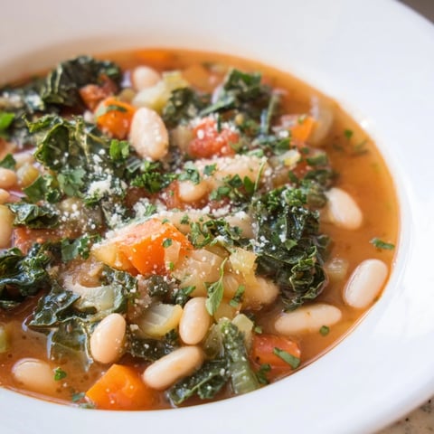 Sizzling Italian Bean & Kale Stew with vibrant greens and hearty beans, perfect for a warming supper.
