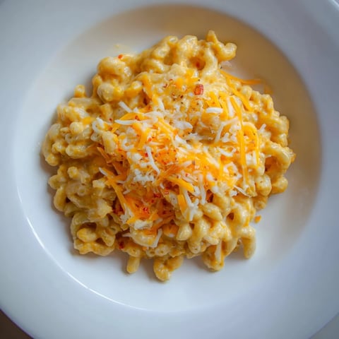 One-Pot Butternut Squash Mac & Cheese, rich and creamy, ready to serve with a sprinkle of cheese.