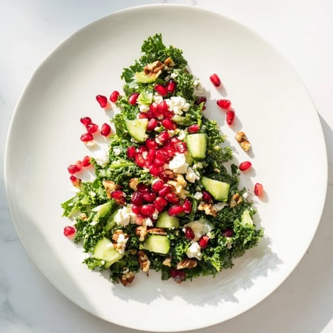 Vibrant Chopped Christmas Tree Salad, with bright pomegranate seeds and creamy feta, ready to serve.