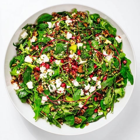 Festive Pomegranate Feta Wreath Salad with vibrant red pomegranate seeds and creamy feta.