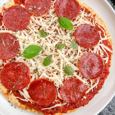 Golden, crispy ground beef pizza base topped with melted mozzarella and sizzling pepperoni.