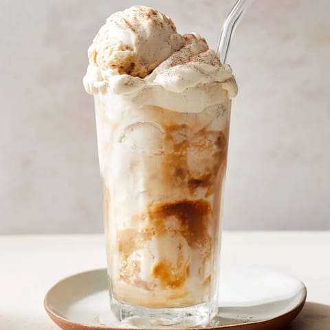 Delicious pumpkin cream soda floats served with scoops of vanilla ice cream.  