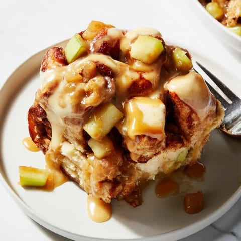 Deliciously baked cinnamon rolls and apples, perfect for cozy brunch gatherings.  