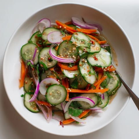 Cucumber salad remix topped with toasted sesame seeds for extra crunch and flavor.  