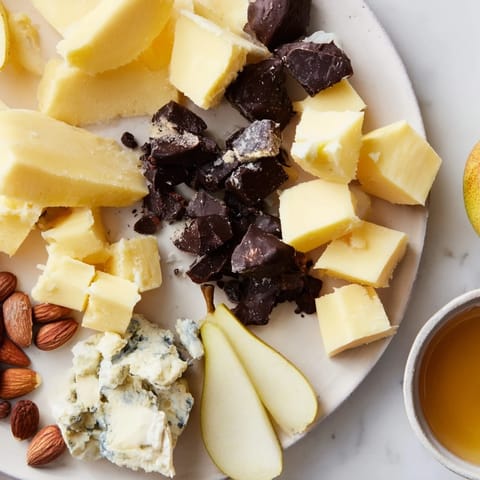 Enjoy this comforting pairing of Fireside Comfort & Cocoa, complete with decadent dark chocolate and cheese wedges.