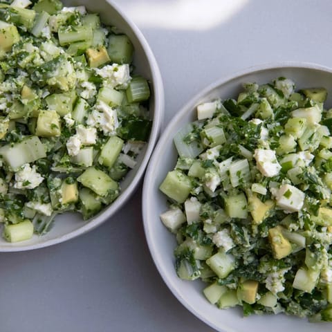 Showcasing a bowl of Green Goddess Cabbage Dip, the bright flavors are ready to be scooped up.