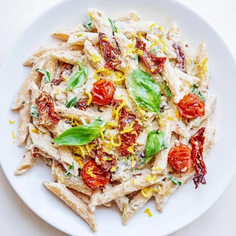 A creamy, dreamy Baked Feta Pasta, with vibrant red tomatoes and rich sun-dried flavor baked.