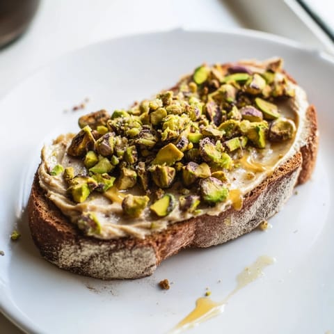 Warm, toasted Pistachio Butter Toast, a simple recipe bursting with sweet, nutty flavors.