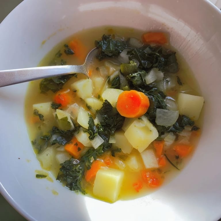Warm, flavorful Vegetarian Potato-Kale Soup, a comforting blend of potatoes, kale, and vegetables simmering in broth.
