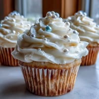 Soft vanilla cupcakes crowned with pearl fondant, perfect for Cancer birthday celebrations.